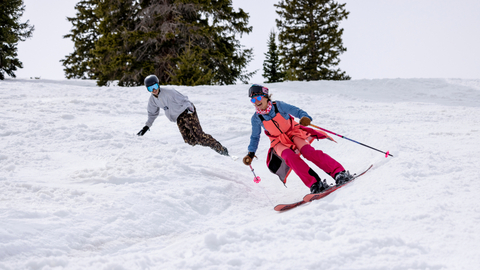 Two friends spring ski at Solitude Mountain Resort.